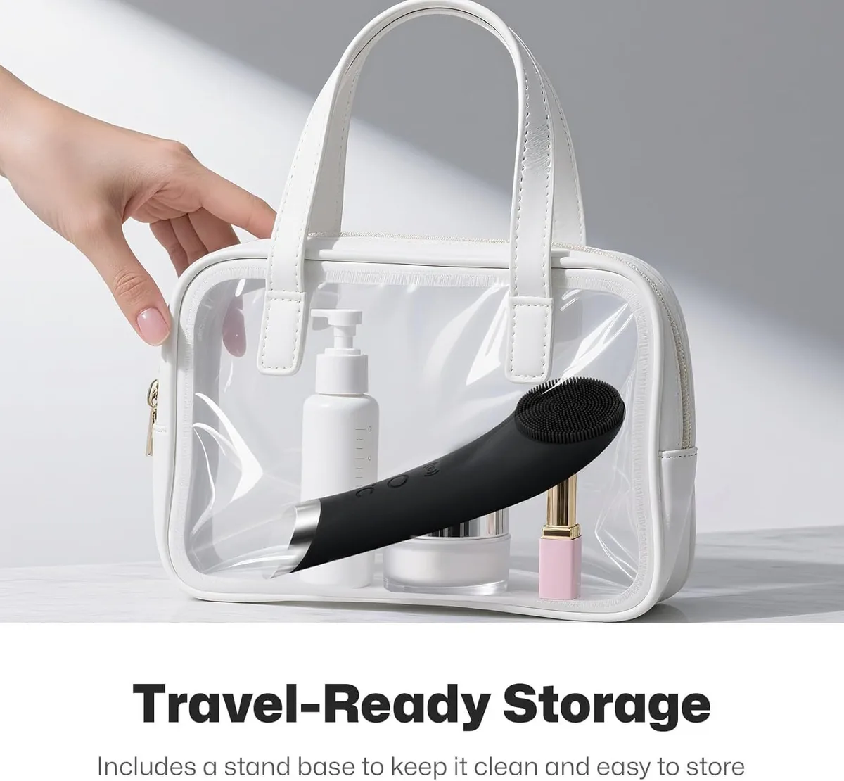 compact facial cleansing brush packed in a clear toiletry bag