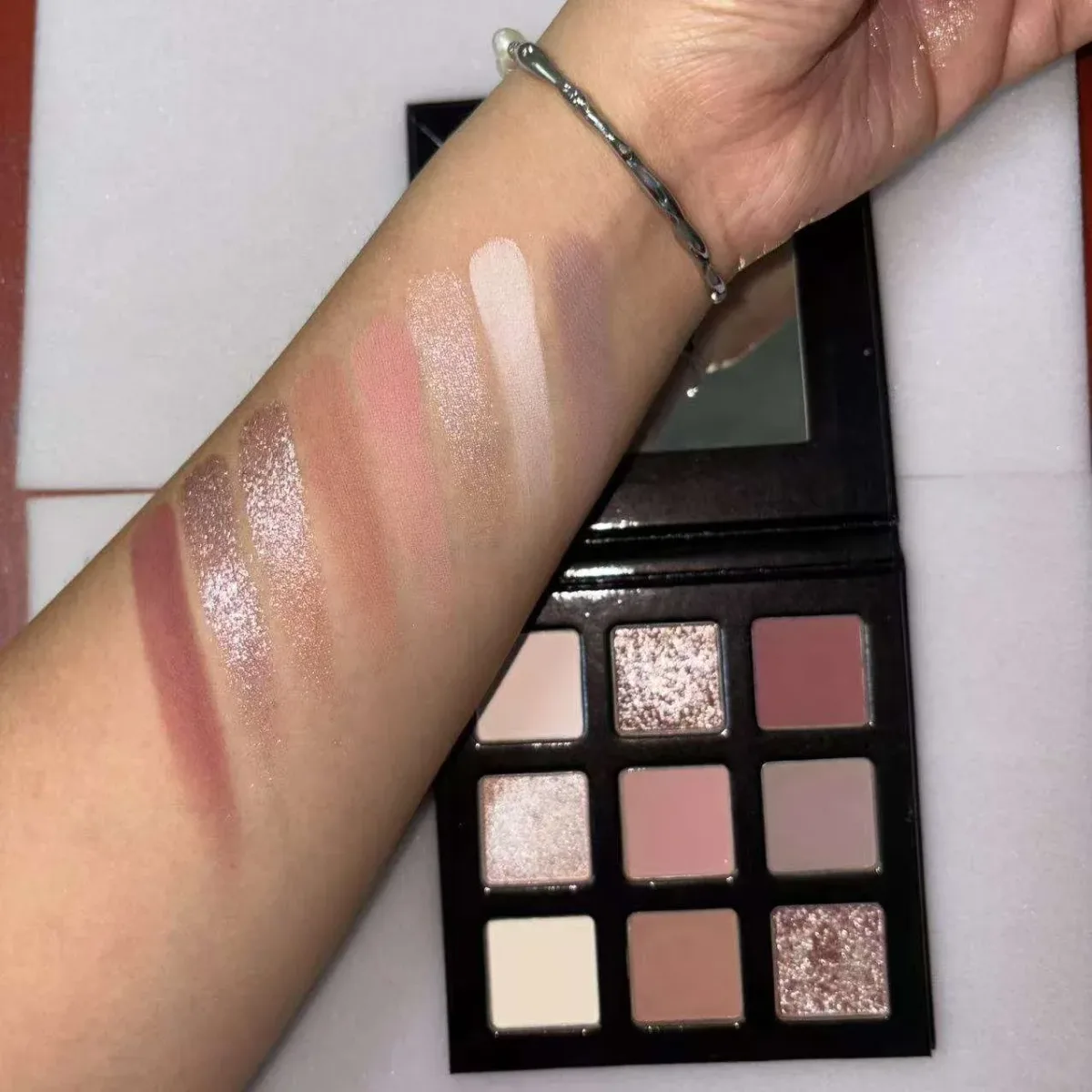 arm swatches of the neutral eyeshadow palette shades