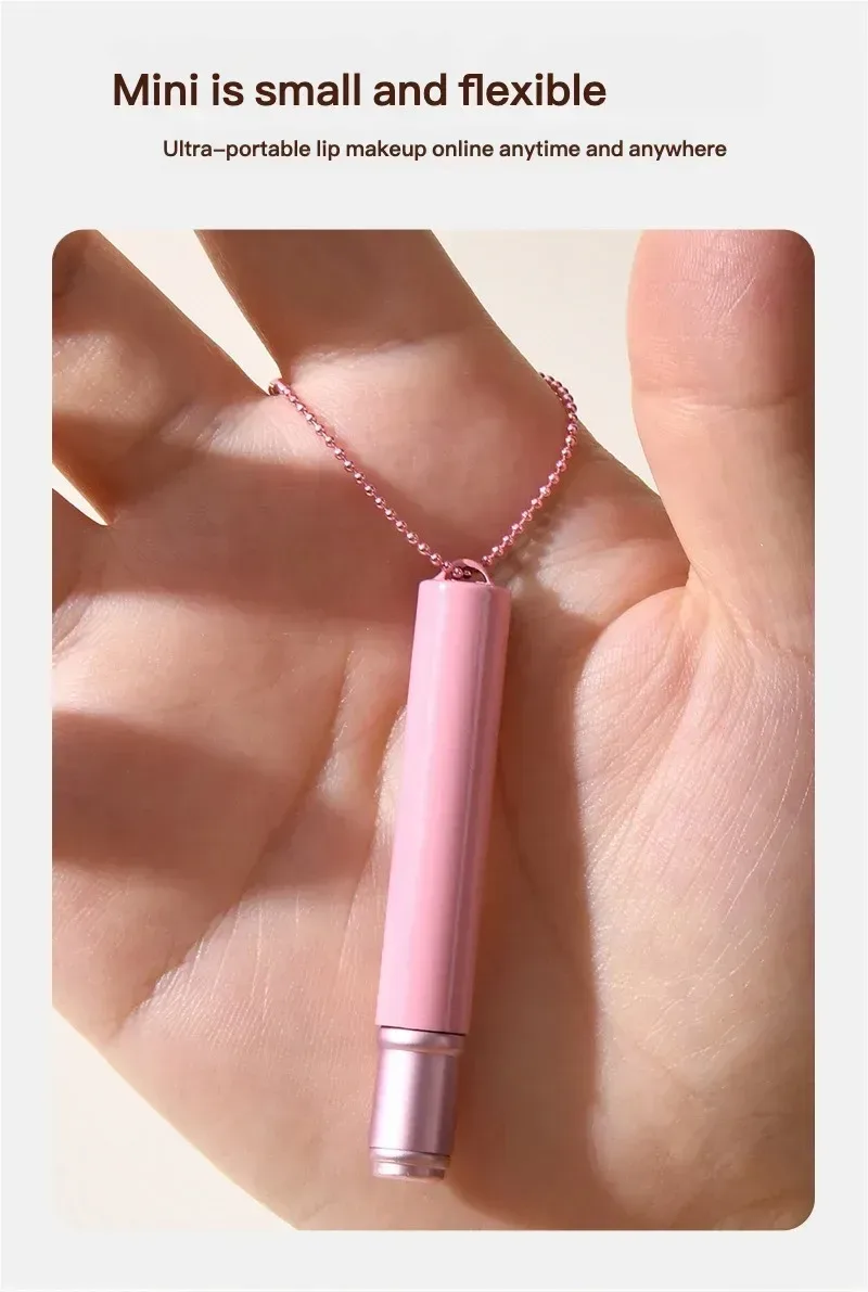 pink mini silicone lip brush held in the palm