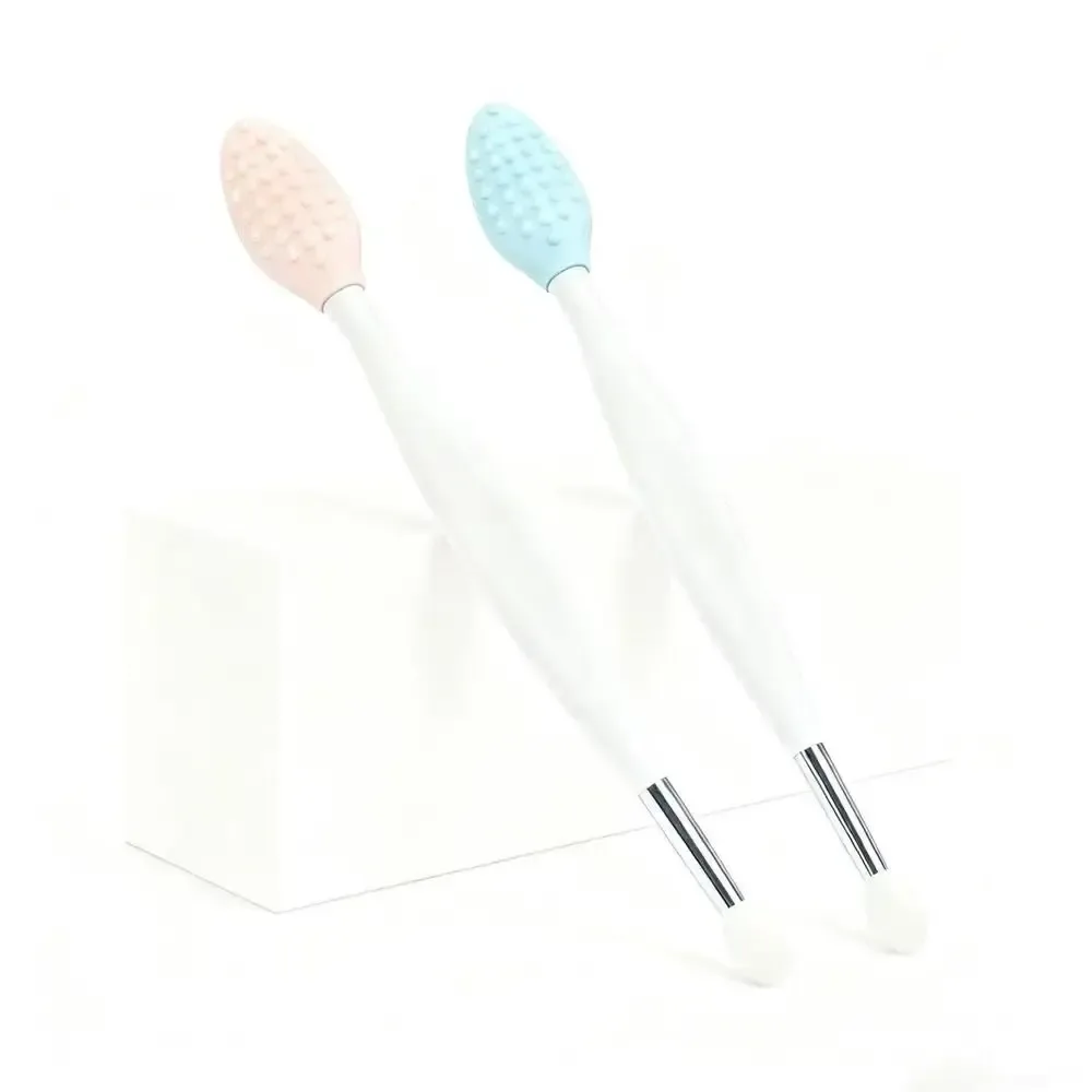 textured silicone scrub heads of two lip scrub brushes